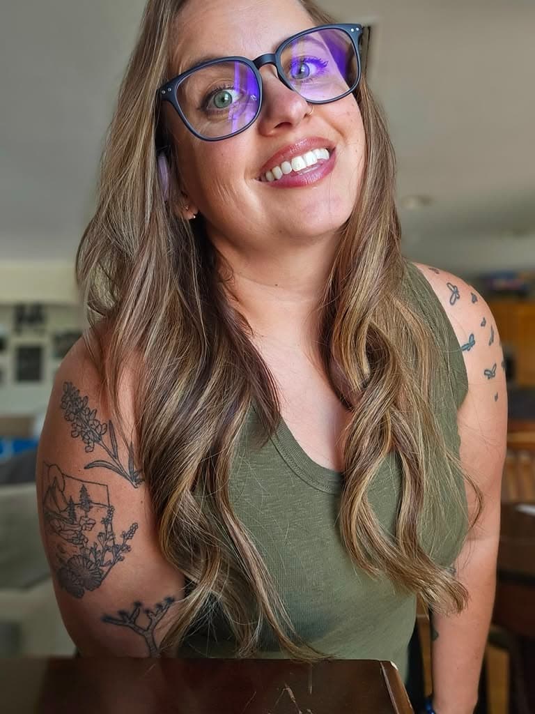 Kerri Lynn smiling in a green tank top